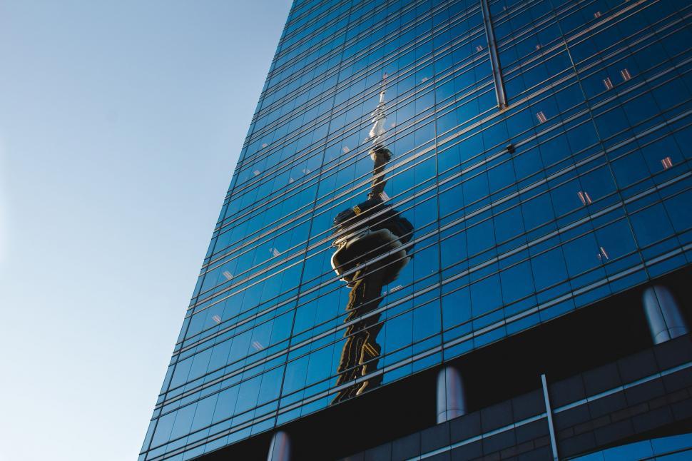 Free Image of Reflection of Building in Windows of Another Building 