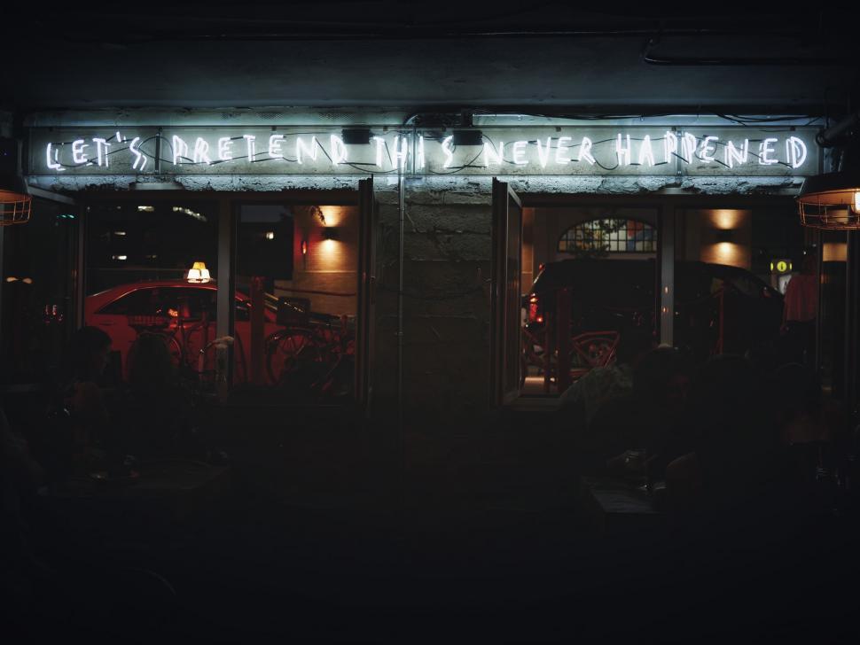 Free Image of Urban Building With Neon Sign: Lets Pretend and Never Happened 
