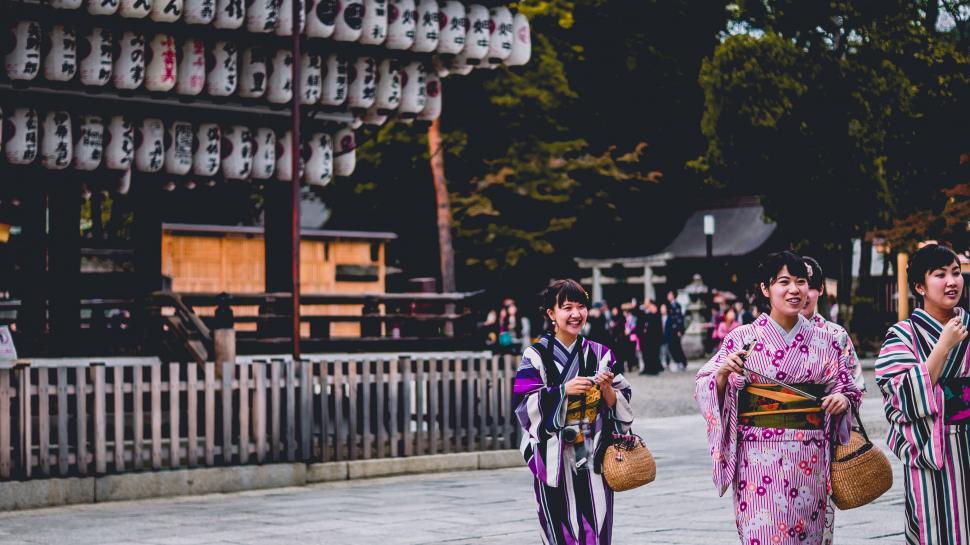 Free Image of Group of Women Walking Down a Street 
