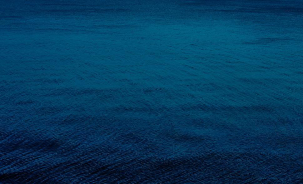 Free Image of Vast Body of Water With Sky Background 