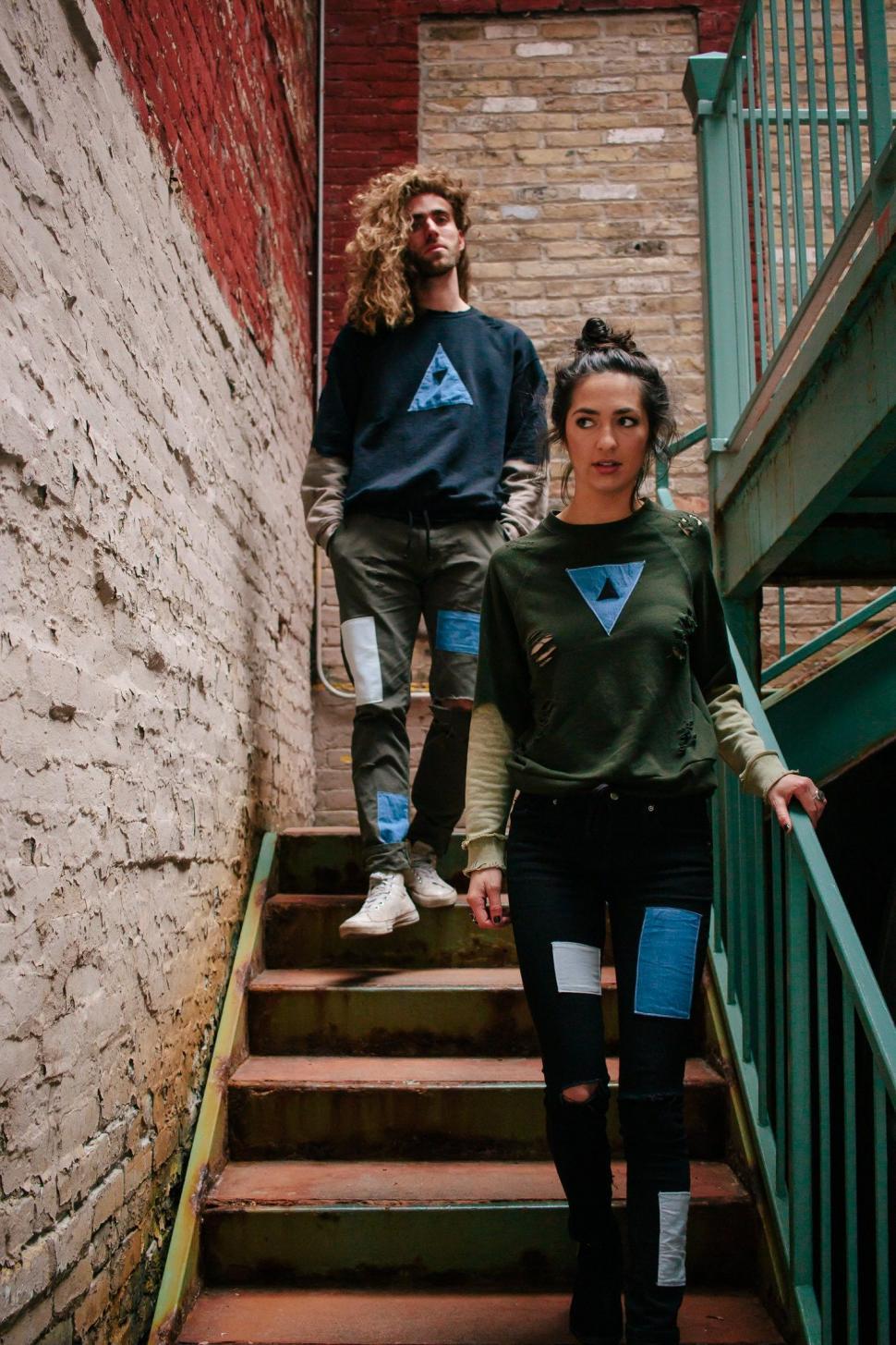 Free Image of Man and Woman Descending Stairs Together 