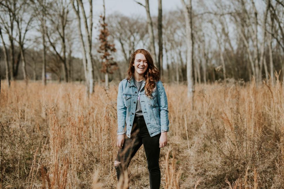 Free Image of Woman Standing in Field of Tall Grass 