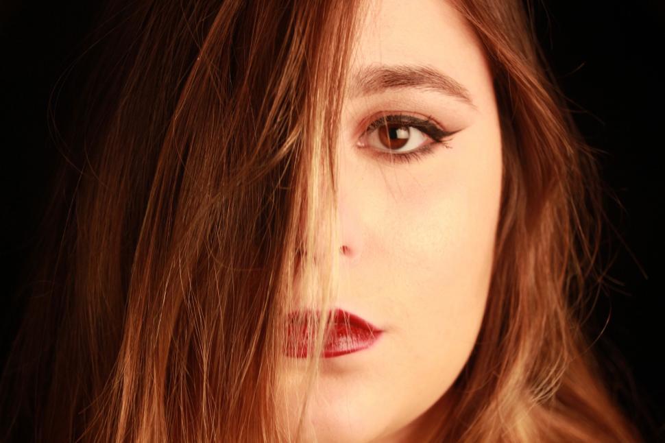 Free Image of Womans Face Painted With Hearts 
