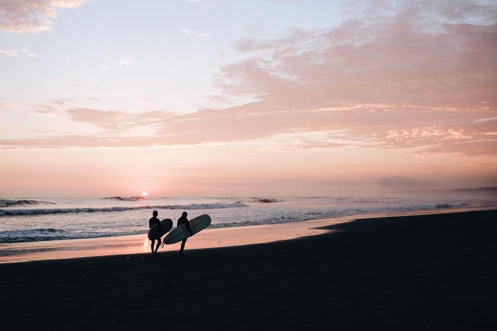 Free Image of Couple Standing on Top of Beach 