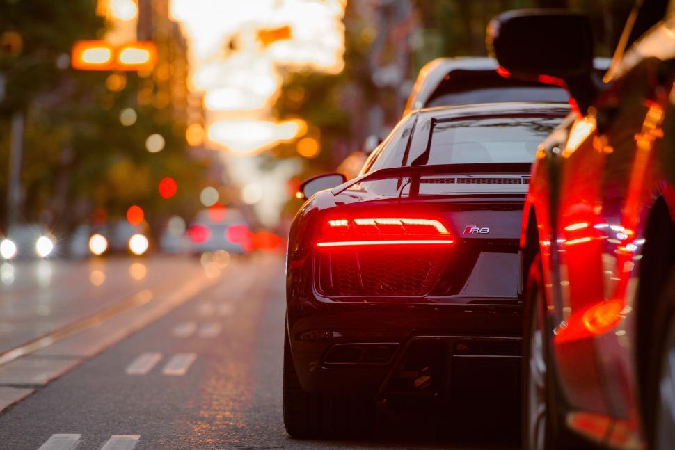Free Image of Two Cars Parked on a Street 