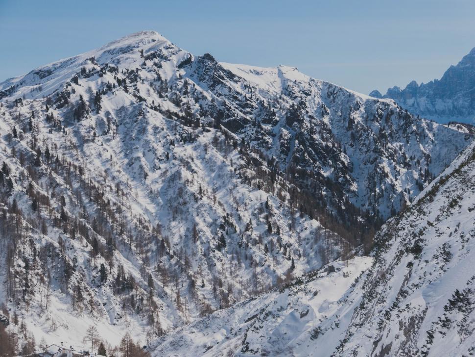 Free Image of Snowboarder Descending Snowy Mountain 