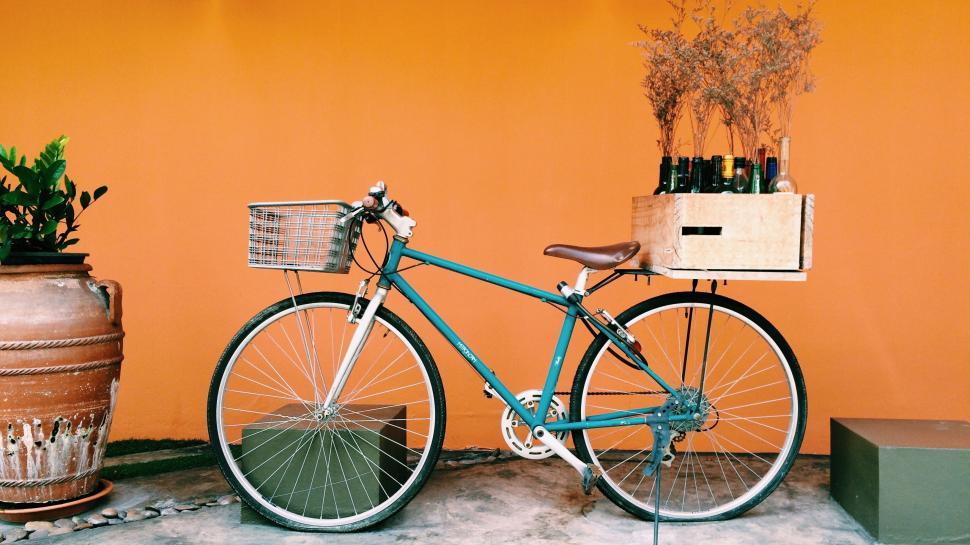 Free Image of Blue Bicycle Parked Next to Yellow Wall 