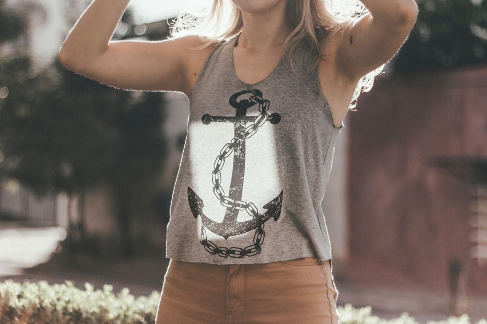 Free Image of Woman Wearing Tank Top and Brown Pants 