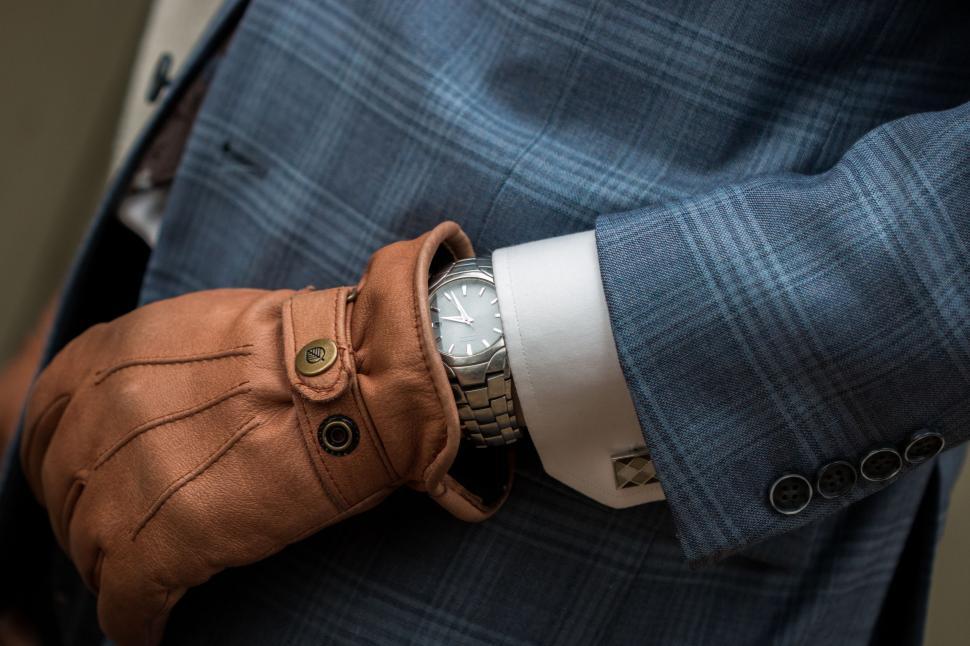 Free Image of Man in Blue Suit With Brown Glove 