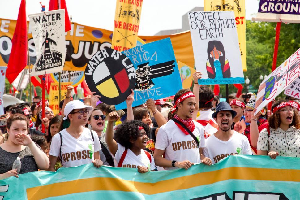 Free Image of Large Group of People Holding Up Signs 