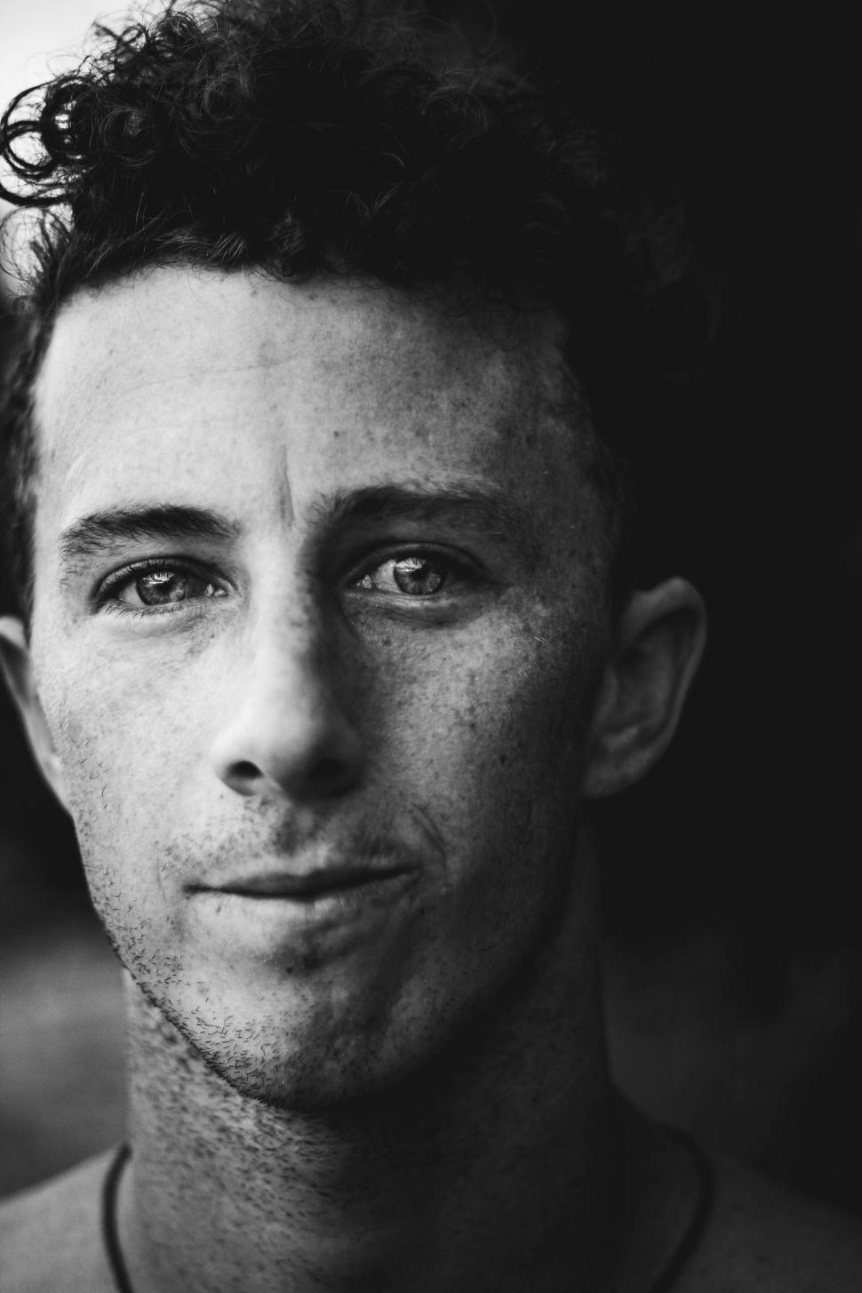 Free Image of Man With Curly Hair in Black and White 