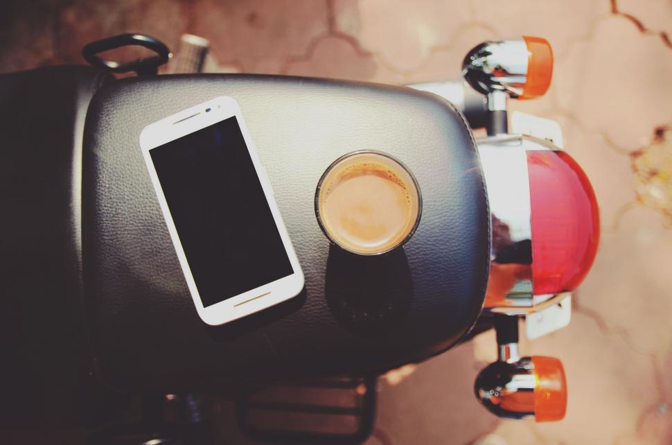 Free Image of Close Up of Motorcycle With Cell Phone 