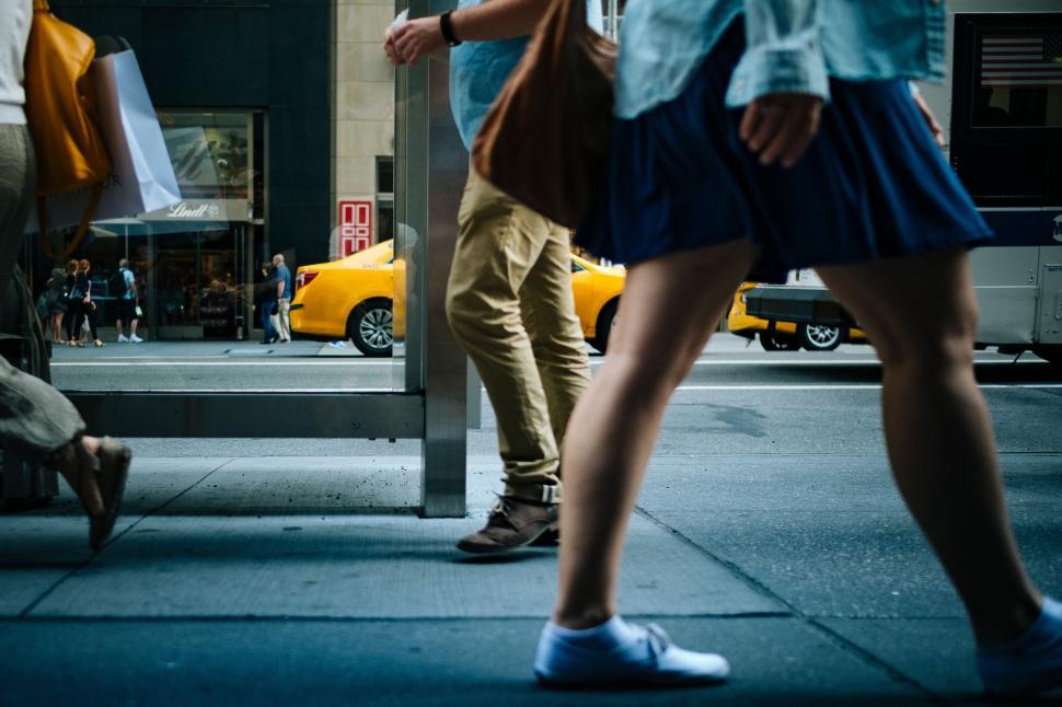 Free Image of Couple Walking Down City Street 