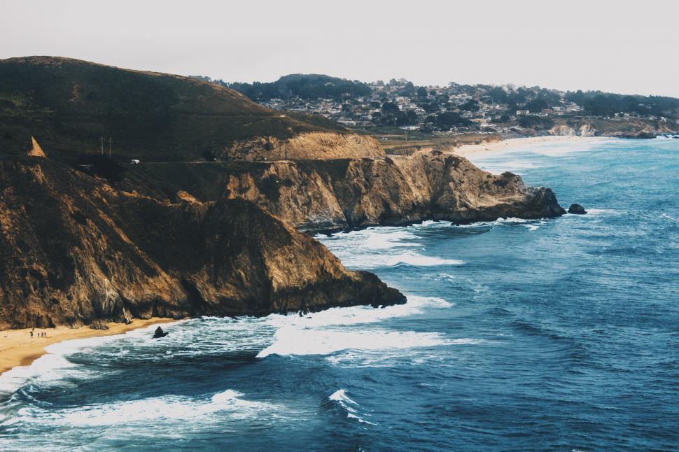 Free Image of Waves Crashing on a Beach Shore 