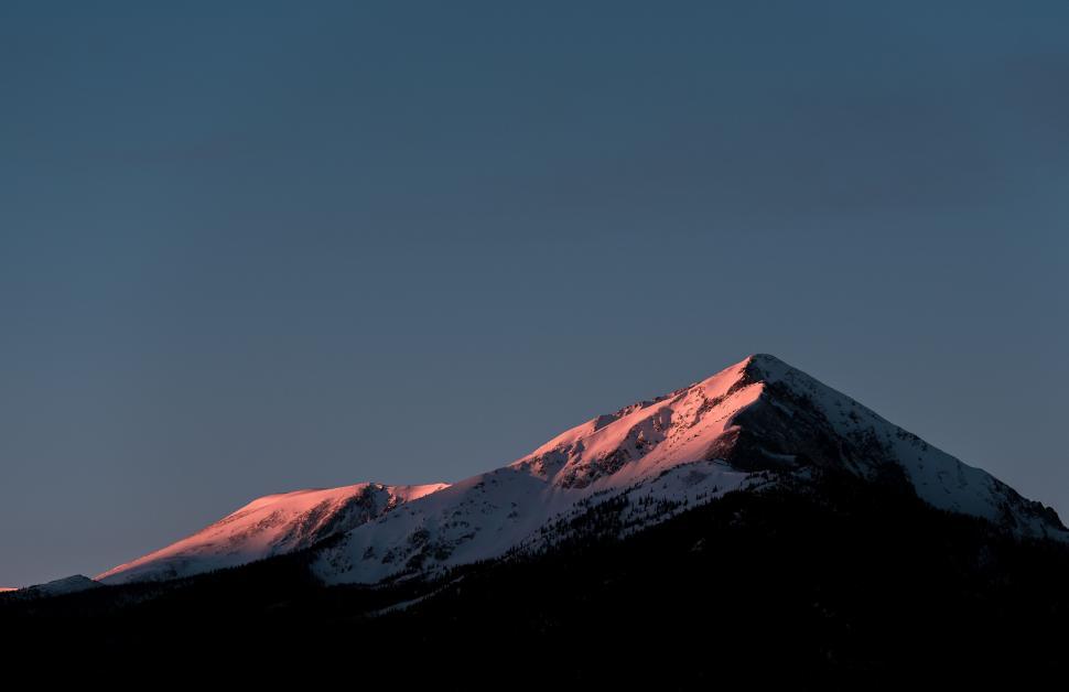Free Image of Majestic Snow Covered Mountain Under Blue Sky 