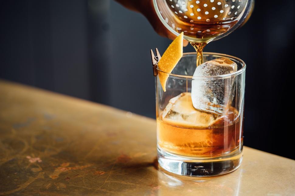 Free Image of Person Pouring Drink Into Glass 