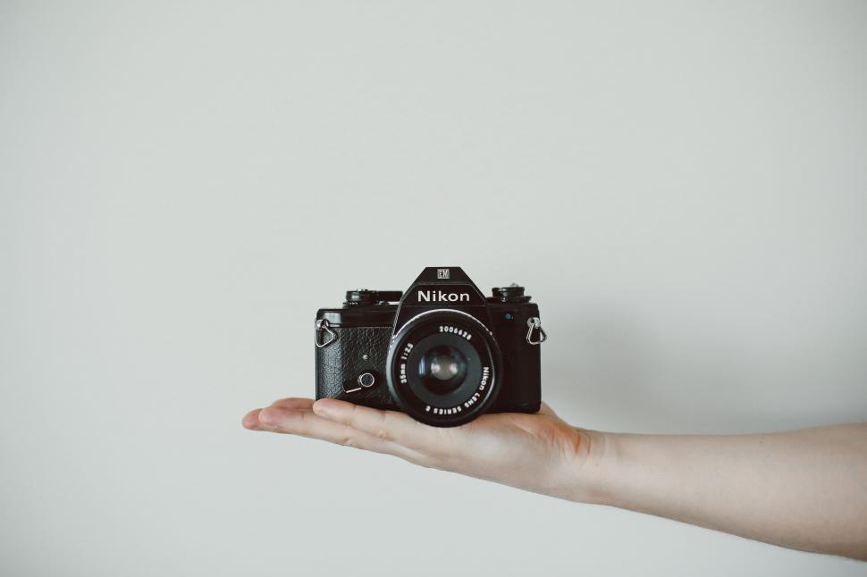 Free Image of Person Holding Camera in Hand 