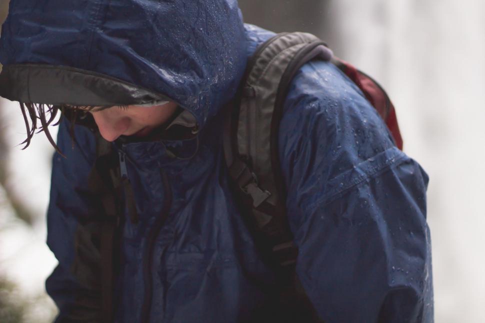 Free Image of Man in Blue Jacket Holding Cell Phone 