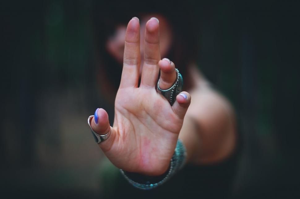 Free Image of Person Holding Hand Up in the Air 