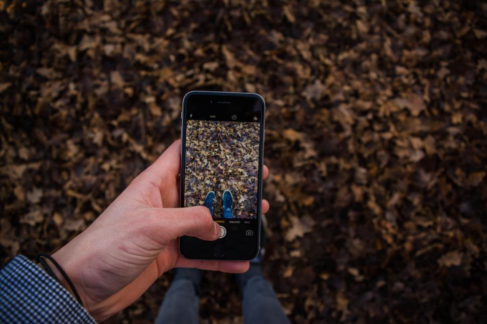 Free Image of Person Holding Cell Phone Taking a Picture 
