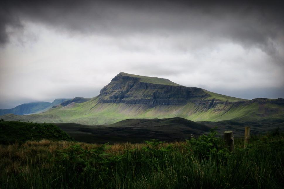 Free Image of Green Mountain Against Dark Sky 