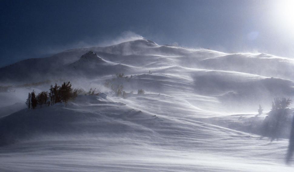 Free Image of Person Skiing Down Snow Covered Mountain 