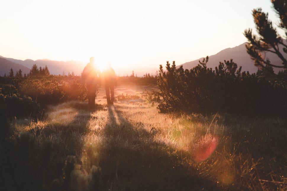 Free Image of Person Riding Bike Down Dirt Road 