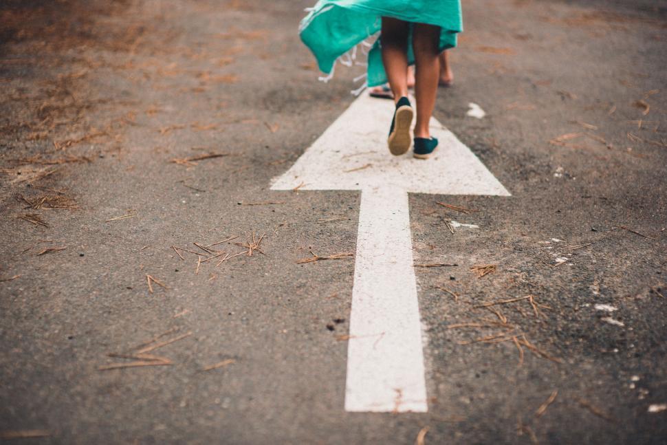 Free Image of Woman Crossing Street in Green Dress 