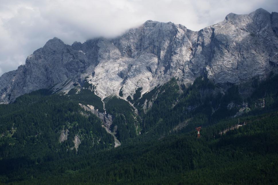 Free Image of Majestic Mountain Range Under Cloudy Sky 
