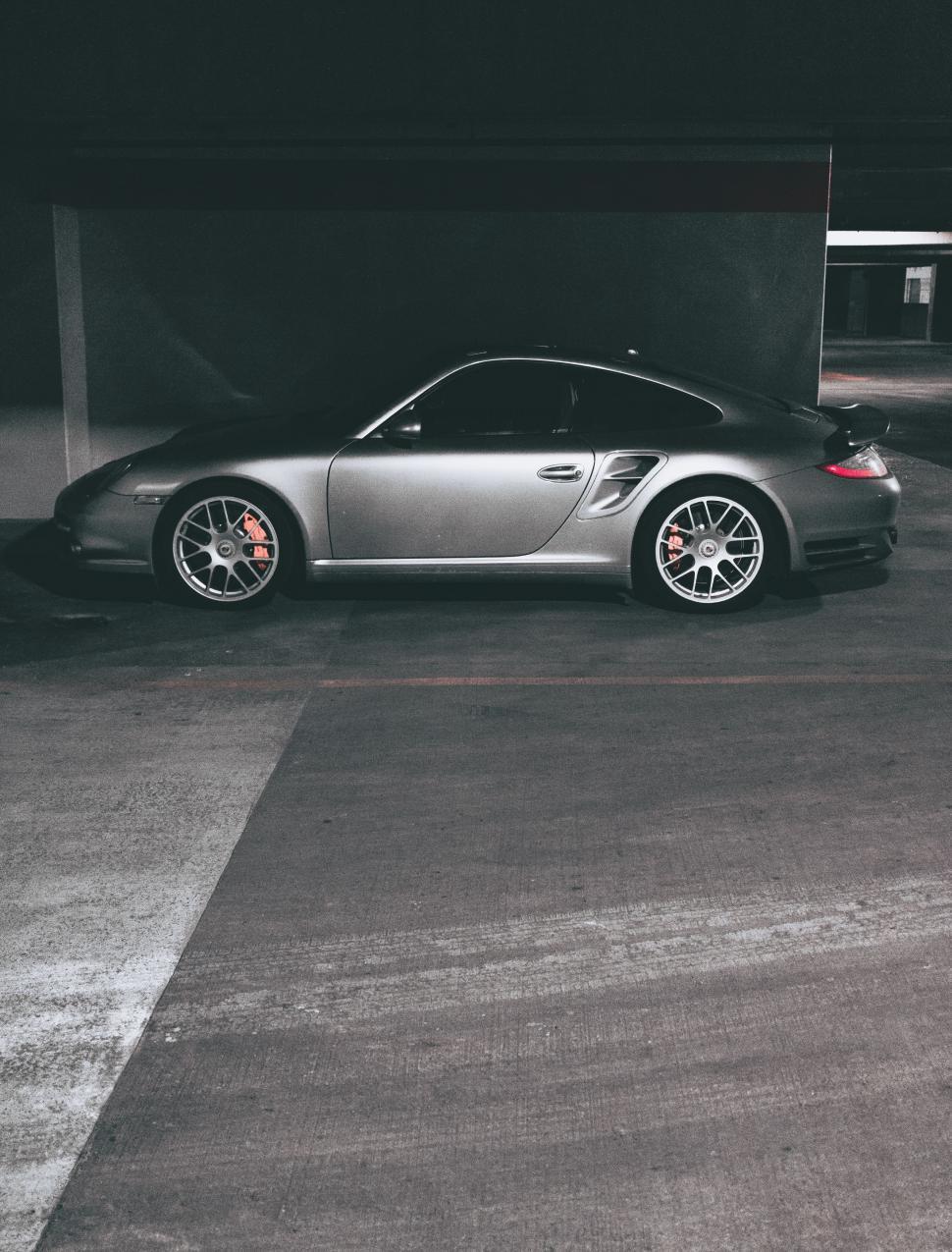 Free Image of Silver Sports Car Parked in Parking Lot 