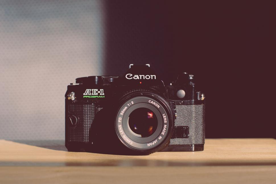 Free Image of Camera on Wooden Table 