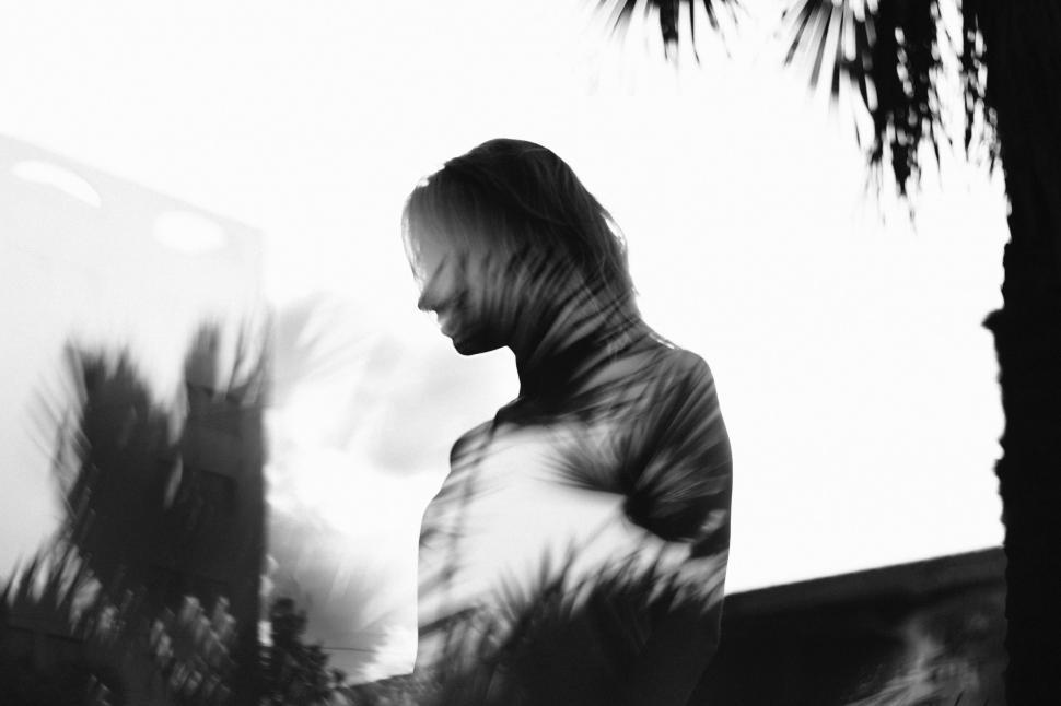 Free Image of Black and White Portrait of a Man With Long Hair 