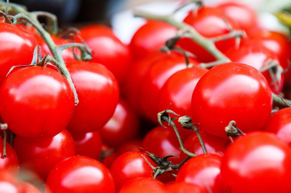 Free Image of A Pile of Red Tomatoes on Top of a Table 