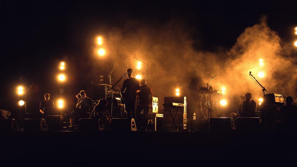 Free Image of Group of People Standing in the Dark 