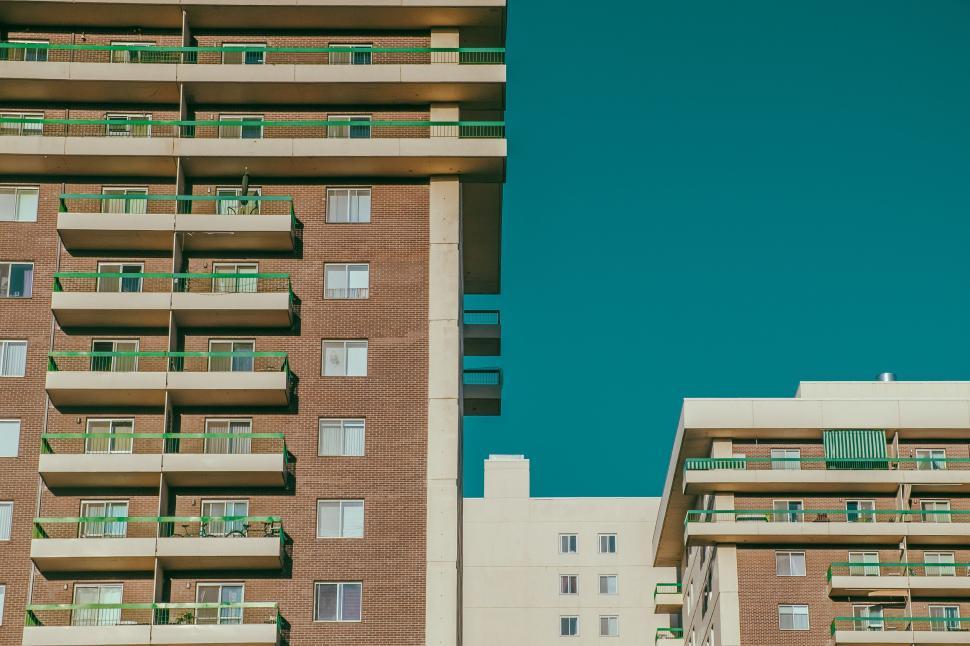 Free Image of Two Tall Buildings With Balconies and Balconies on Them 
