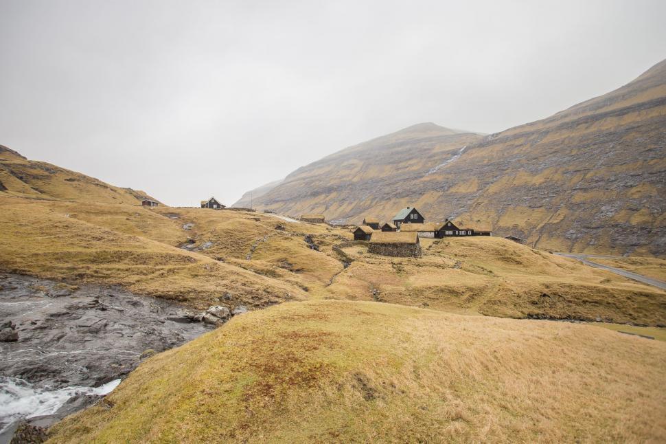 Free Image of Houses Perched on Lush Green Hillside 