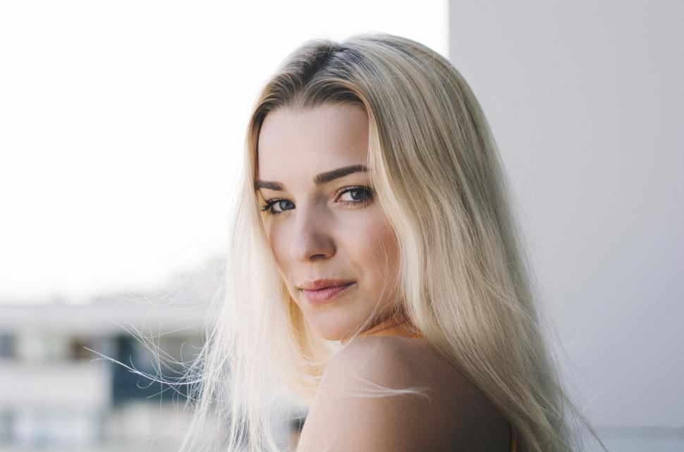Free Image of Woman With Long Blonde Hair Posing for Picture 