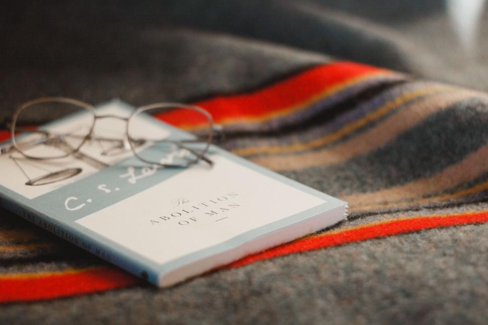 Free Image of Glasses Resting on Blanket 