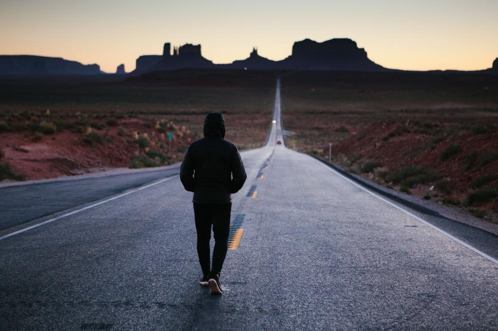 person-walking-down-middle-of-road.jpg
