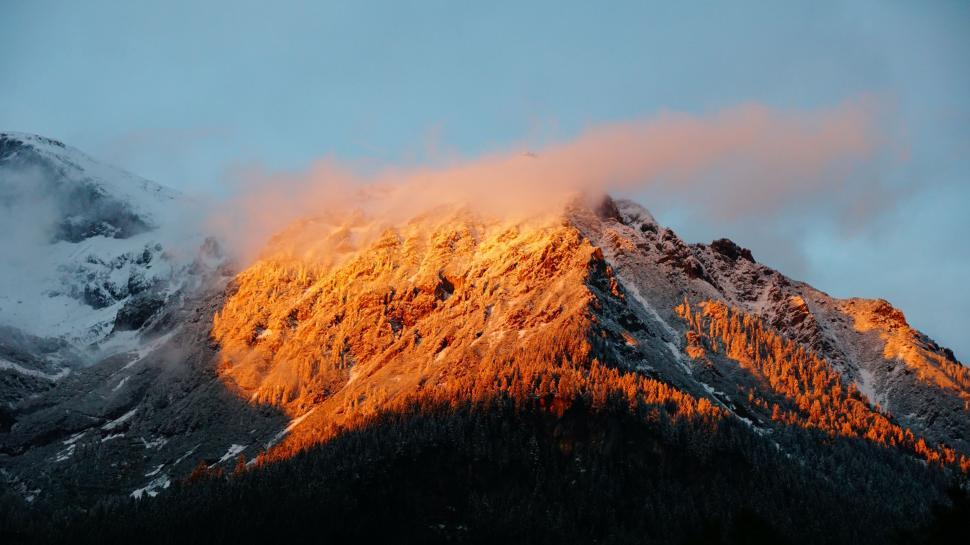 Free Image of Snow-Covered Mountain Under a Clear Sky 