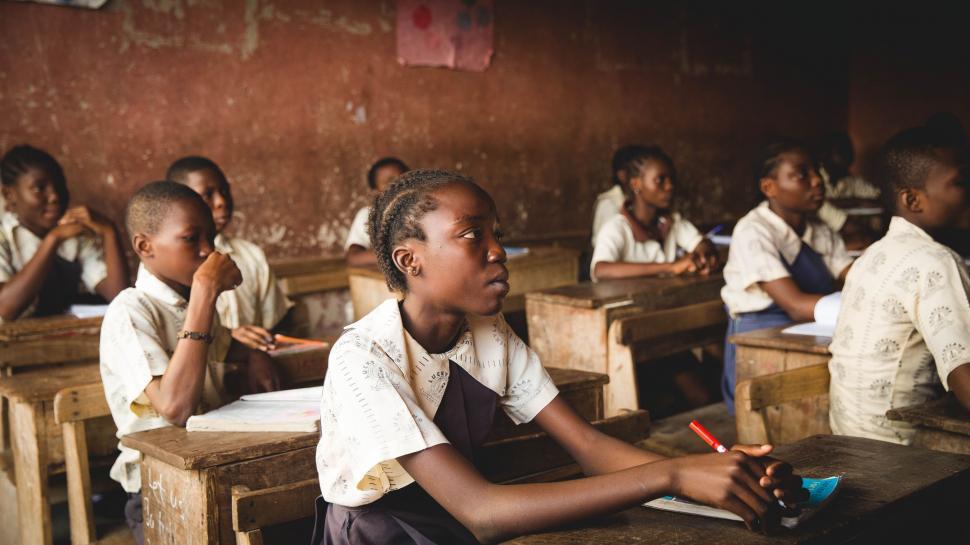 Free Image of Group of Children Sitting at Desks in a Classroom 