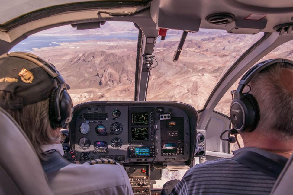 Free Image of Men Sitting in the Cockpit of a Plane 