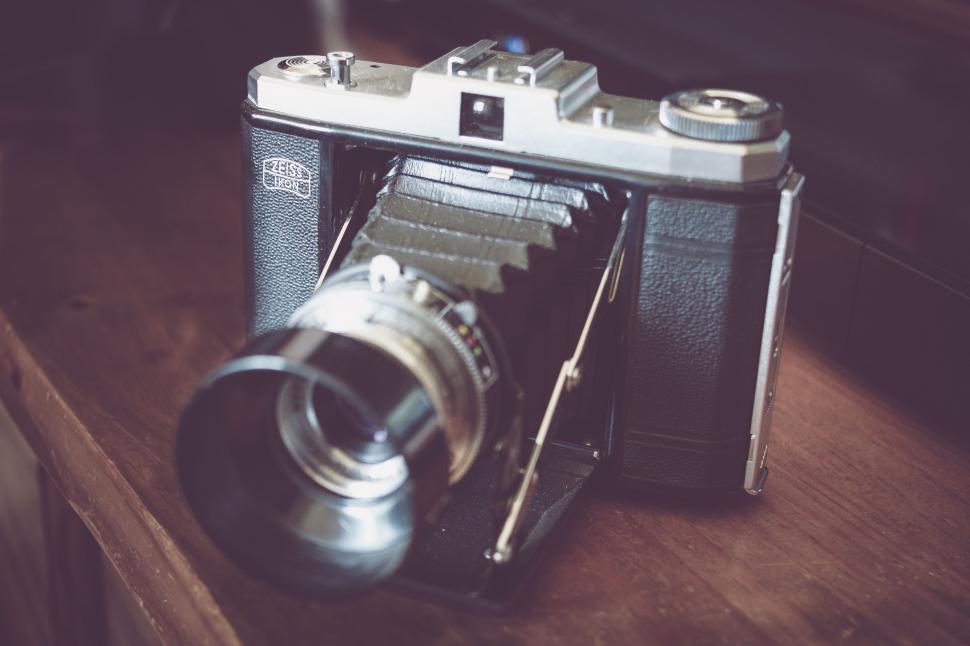 Free Image of Camera on Wooden Table 