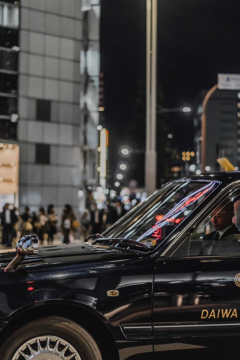 Free Stock Photo of Black Taxi Cab Driving Down Street at Night ...