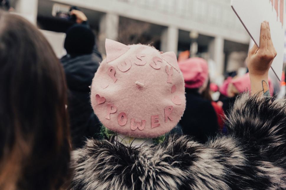Free Image of Crowd of People Holding Up Signs and Hats 