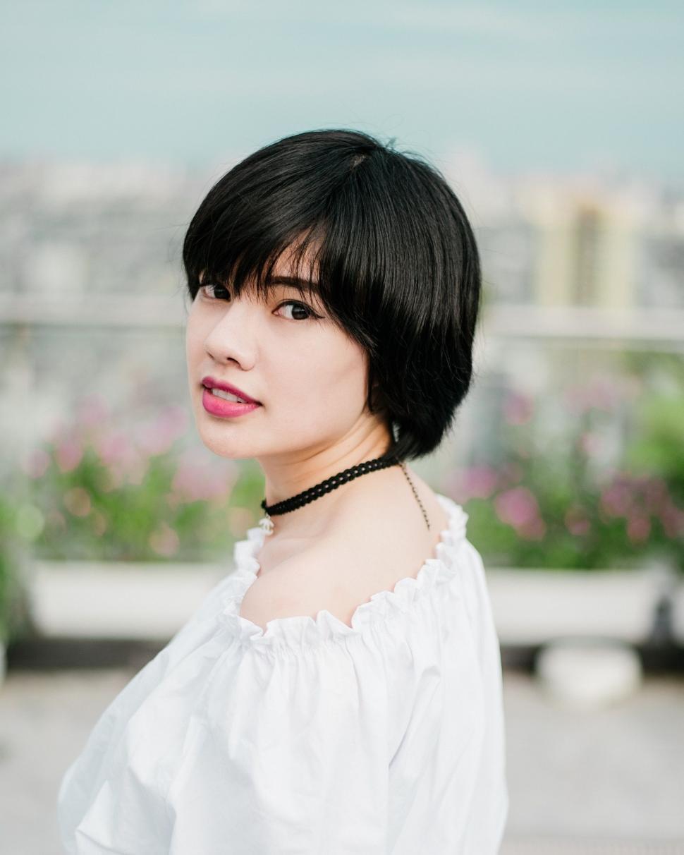 Free Image of Woman With Black Hair Wearing White Shirt 