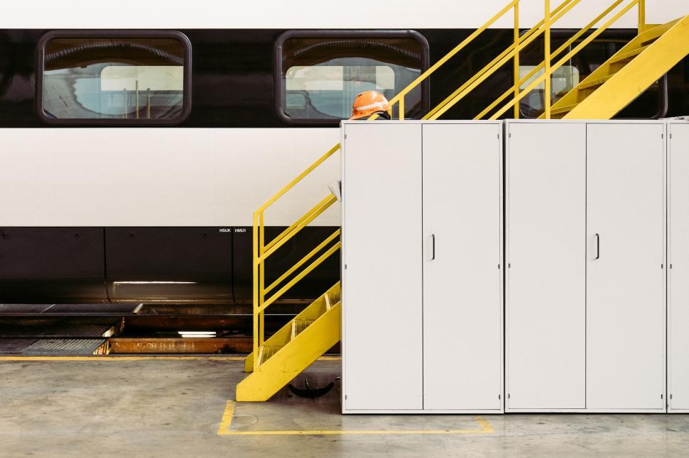 Free Image of White Train With Yellow Stairs 