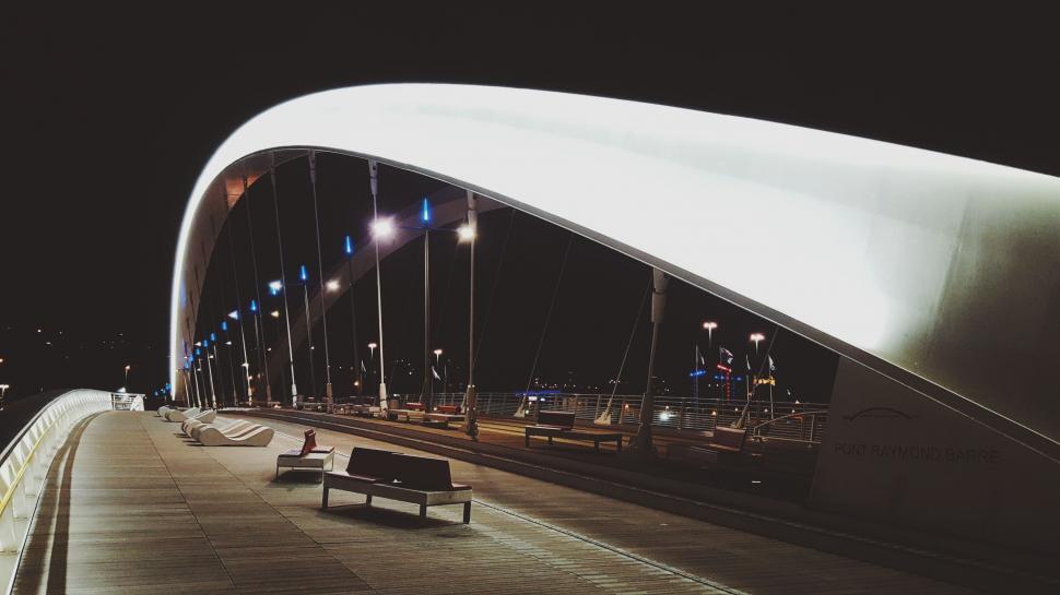 Free Image of Bench on Bridge Side at Night 