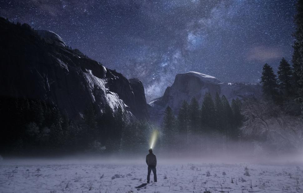 Free Image of Man Standing in Snow Covered Field 