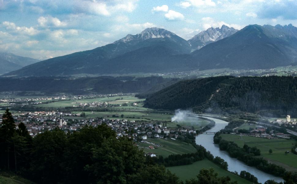 Free Image of River Flowing Through Lush Green Valley 